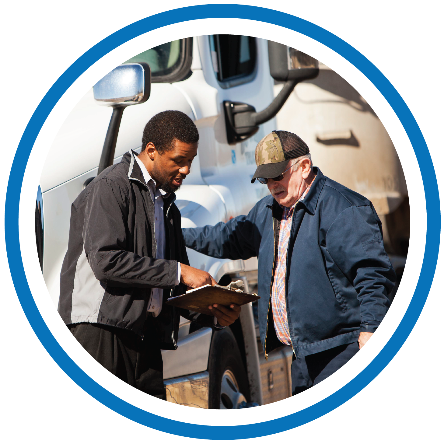 image of two men in front of a truck