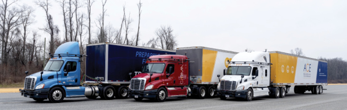 "This photo shows three CMVs in a row, staggered from left to right. Source: Federal Motor Carrier Safety Administration."