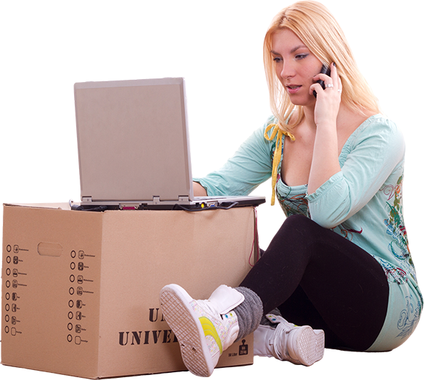 Image of a woman on the phone, sitting next to a moving box with a computer on top