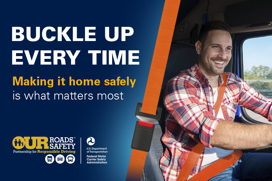 Male truck driver behind the wheel. Buckle up every time.