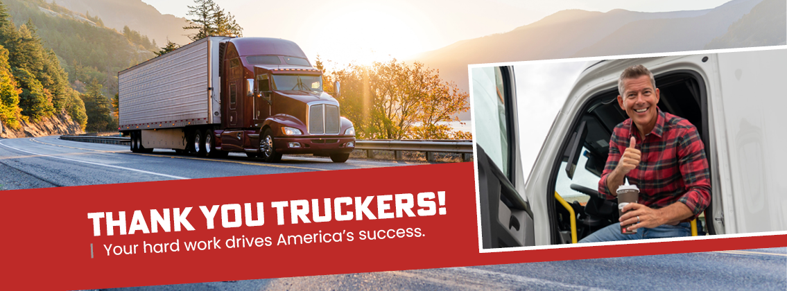 Man with a thumbs up in a truck. Truck on a road. 