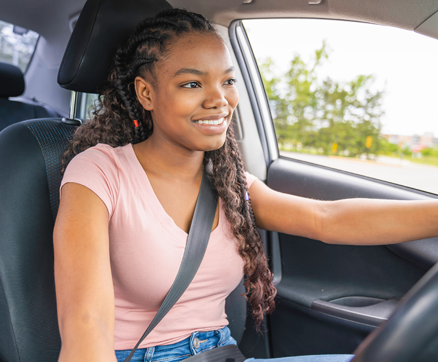 Young female teen behind the wheel