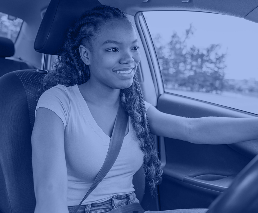 Young female teen behind the wheel