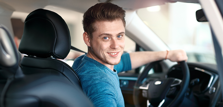 Young male driver behind the wheel