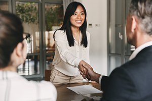 Student being hired with handshake