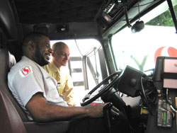 Joe Green, Safeway driver, shows Dr. Kurt Hegmann his truck