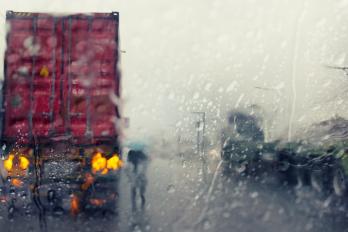 Truck driving in stormy conditions