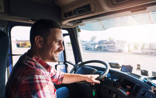 smiling man driving truck