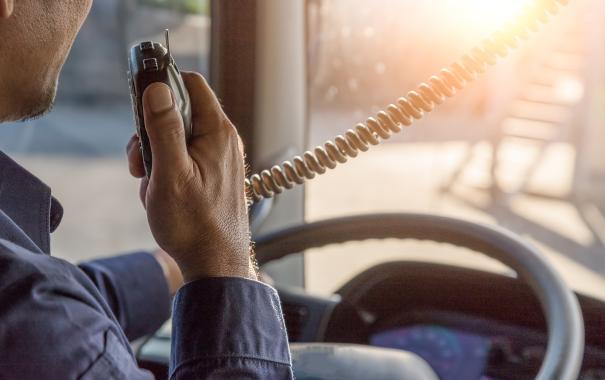 man on radio in truck