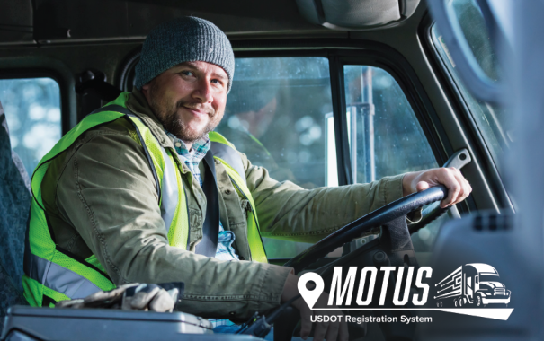 man driving truck with Motus logo