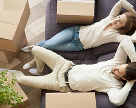 Happy couple with boxes