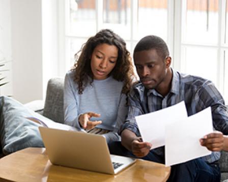 Couple looking at laptop