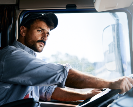 Man driving a large truck